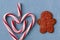 Candycane Heart Symbol on Blue Wood with Gingerbread Man