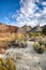 Candyland cracked earth and colorful sandstone rock formations