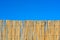 Cane fence with blue sky