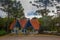 CANELA, BRAZIL - MAY 06, 2016: nice entrance to the park of the city, red roof tiles and white wood walls