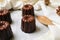 Caneles de bordeaux - traditional French sweet dessert serve with tea or coffee on wooden