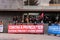 CANGAS, PONTEVEDRA, SPAIN - May 01, 2022: labour day protesters with red banner outside the town hall