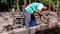Canggu, Bali, Indonesia, 27 May 2020. bricklayer lays a brick close-up. Traditional work in Bali