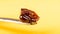 cannabis wax dab concentrate on a stick for smoking essential oils on yellow background closeup