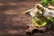 Canned artichokes in olive oil, in glass jar, rustic wooden kitchen table background, still life, sfallow DOF selective focus