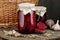 Canned beetroot in glass jars on rustic wooden background, closeup, food storage solution