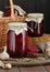 Canned beetroot in glass jars on rustic wooden background, closeup, food storage solution