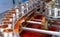 Canned fish factory. Food industry.  Sardines in red tomato sauce in tinned cans at food factory. Food processing production line