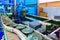 Canned food products on conveyor belt in distribution warehouse