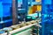 Canned food products on conveyor belt in distribution warehouse.