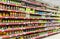 Canned fruits and vegetables in cans on the shelves