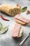 Canned ham slices sandwich, on gray stone table background