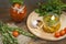 Canned marinated tomatoes in tomato juice on a wooden table