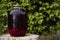 Canned raspberry compote in a glass jar