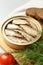 Canned sprats, dill and tomato on table, closeup
