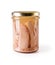 Canned tuna fillet pieces in a glass jar with yellow metal lid isolated on white background. Preserved tuna fish meat as