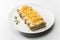 Cannelloni with meat topped with cheese