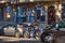 CANNES, FRANCE - JUNE 19, 2017: Unknown young woman in blue jeans sits on a motorcycle waiting for the traffic to start. Historic