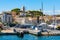 Cannes seafront panorama with castle hill over historic old town Centre Ville quarter and yacht port in France