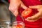 Canning fresh tomatoes with onions in jelly marinade.