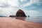 Cannon Beach, Oregon coast: the famous Haystack Rock reflects itself in the water