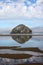 Cannon Rock On the Oregon Coast Reflected at Low Tide on a Beautiful Cloudy Morning