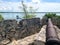 Cannon on the wall of the fort of San Felipe in Bacalar Lagoon