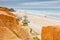Canoa beach with red cliffs