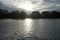 Canoe athletes from Treptower Rudergemeinschaft e.V. rowing along the Spree River at sunset in autumn.