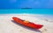 Canoe boat on white sand turquoise sea Rasdhoo island Maldives