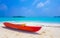 Canoe boat on white sand turquoise sea Rasdhoo island Maldives