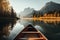 Canoe floating on a serene mountain lake surrounded by tall pine trees on a peaceful morning