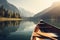 Canoe floating on a serene mountain lake surrounded by tall pine trees on a peaceful morning