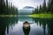 a canoe floating on a tranquil alpine lake surrounded by evergreens