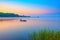 Canoe on a forest lake at sunrise