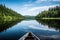 canoe and kayak being paddled through calm, serene lake