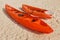 canoe and kayak with paddles lie on a sandy beach on a tropical island, waiting for adventurers and tourists to explore the