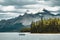 A canoe on maligne lake in summer with a backdrop of the canadian rockies in jasper national park, alberta, canada