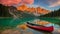 The canoe positioned at the heart of a pristine, rippling emerald lake