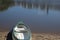 Canoe resting on sand next to lagoon at Ramsgate, Kwazulu Natal.