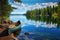 canoe resting on shore with scenic lake view