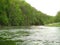 A canoe at river semois with green trees in springtime