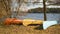 Canoe by the side of the lake during golden hour in natural park