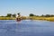 Canoe trip with traditional mokoro boat on river through Okavango Delta near Maun, Botswana Africa