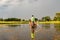 Canoe trip with traditional mokoro boat on river through Okavango Delta near Maun, Botswana Africa