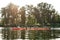 Canoe with young people boating together on a river surrounded by peaceful summer nature