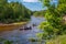 Canoeing on the forest river. Friends driving with kayak on forest river. summer day. canoe trip on the river in the summer