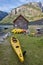 Canoeing in Norway. Fjord landscape with wooden cabin. Recreation