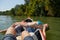 Canoeing on a river, girl in the boat