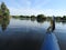 Canoeing on a river with serene still water